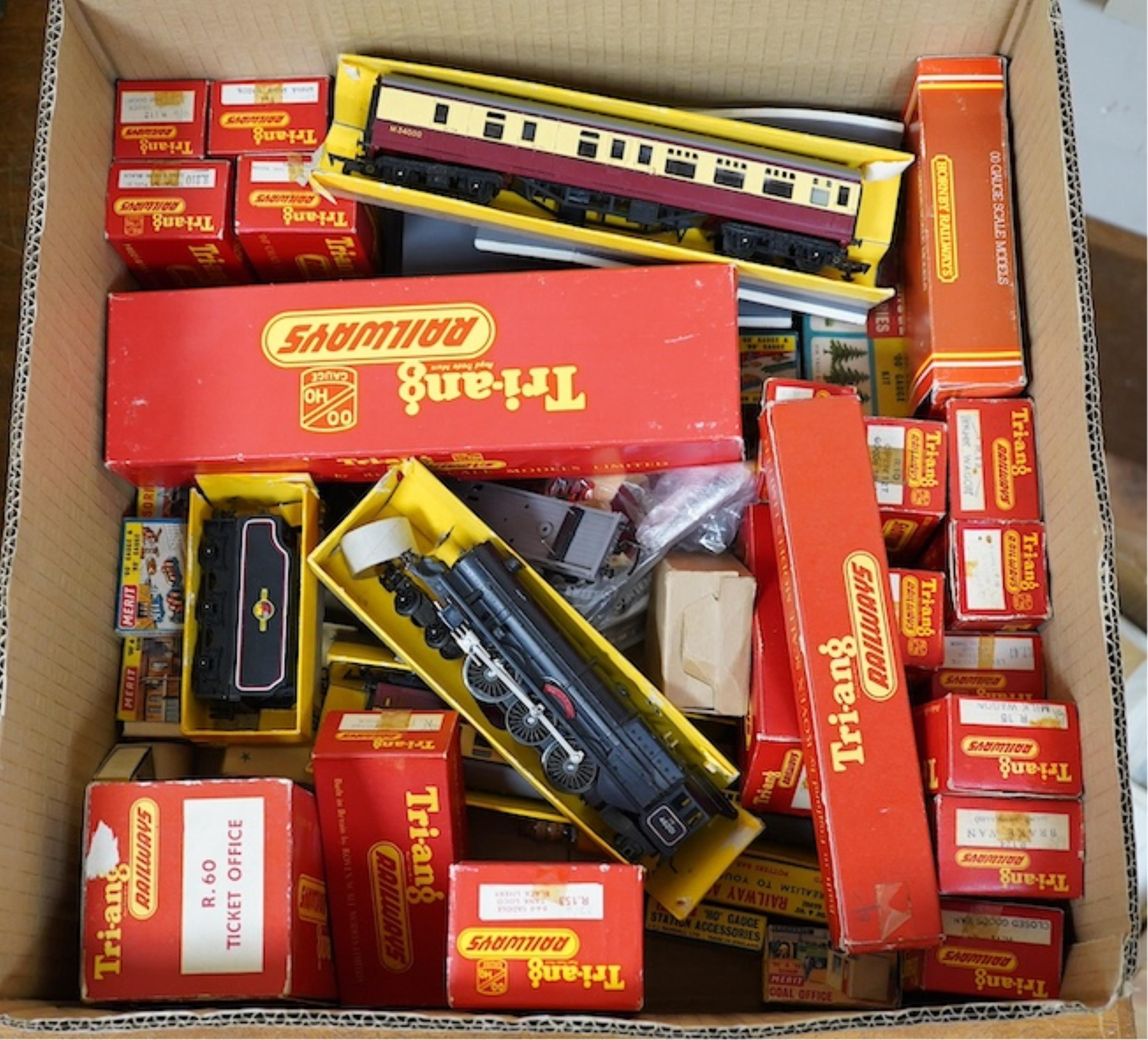 A quantity of mainly boxed Tri-ang 00 gauge railway items including; a BR Princess Royal Class locomotive, freight wagons, ticket office, etc. together with some trackside accessories and figures, etc., in Merit boxes. C